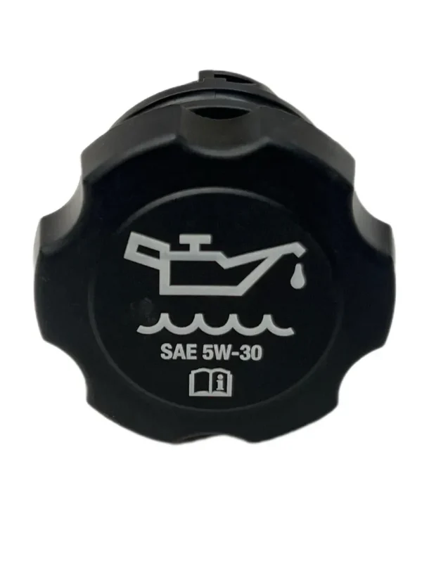 A black gas cap with an oil change symbol.