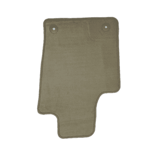 A green floor mat with two holes in it.