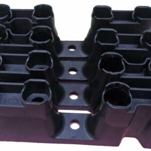 A set of black plastic blocks with holes in them.