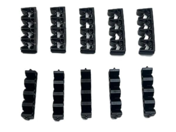 A set of 1 0 black plastic clips for a keyboard.