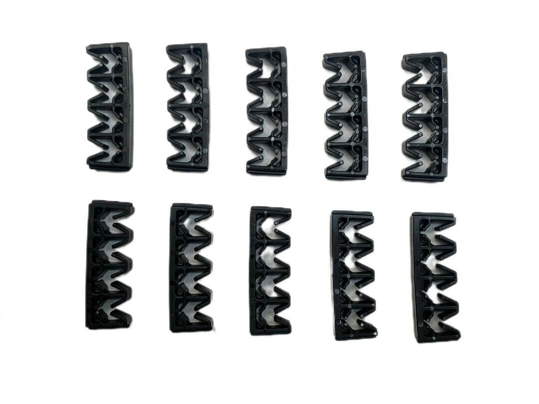 A set of 1 0 black plastic clips for sewing machines.