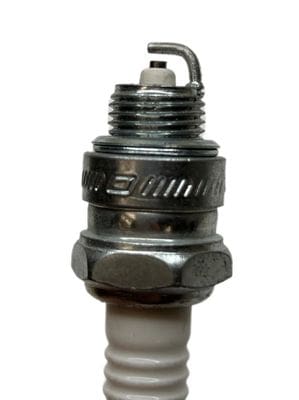 A close up of an engine spark plug