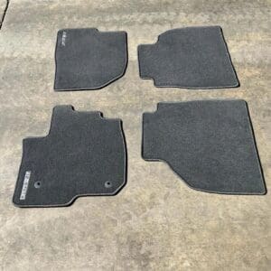 A set of four mats that are on the floor.