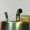 A close up of two pipes on the side of a tank