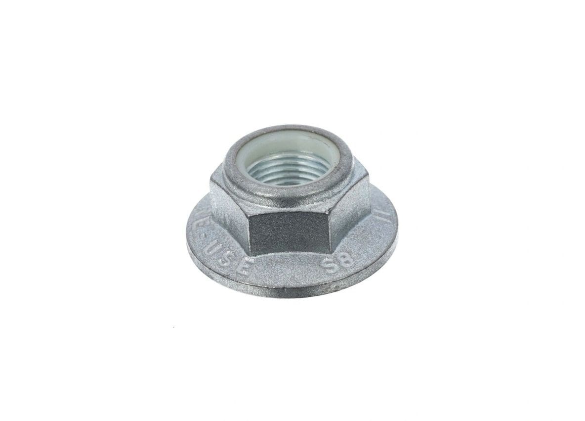 A metal nut with a small hole in the center.