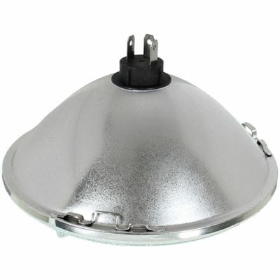 A silver lamp with a black top