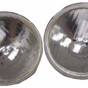 A pair of headlights are shown with the same lens.
