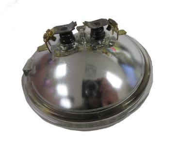 A silver bowl with two metal lids on top of it.