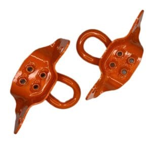 A pair of orange handles with four holes.