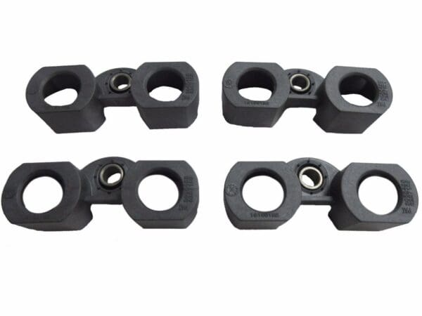 A set of four black plastic clamps with one metal eye.