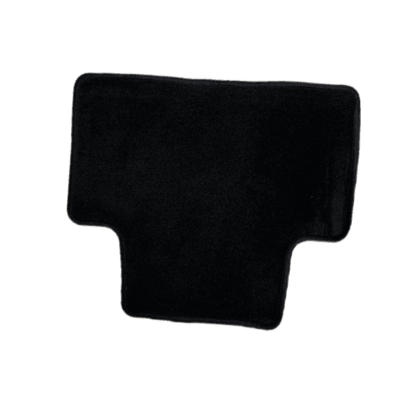 A black piece of fabric on top of green background.
