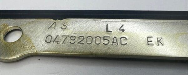 A metal bar with numbers on it.