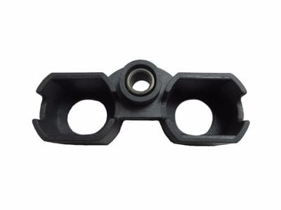 A black plastic object with two holes.